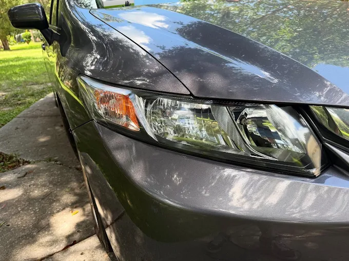 Clear restored headlight on a Honda Civic
