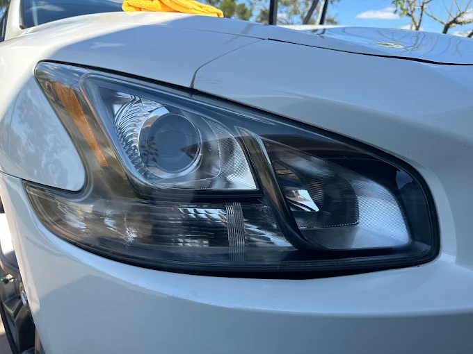 Nissan Maxima headlight and white paint